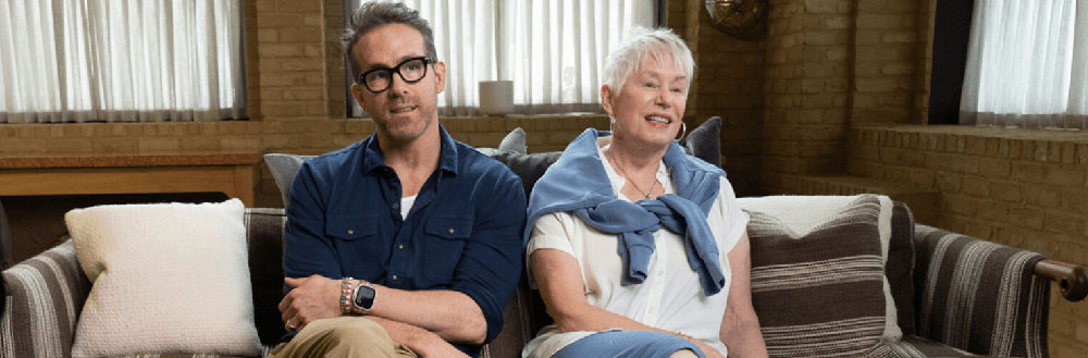 Image of Ryan Reynolds sitting with his mother