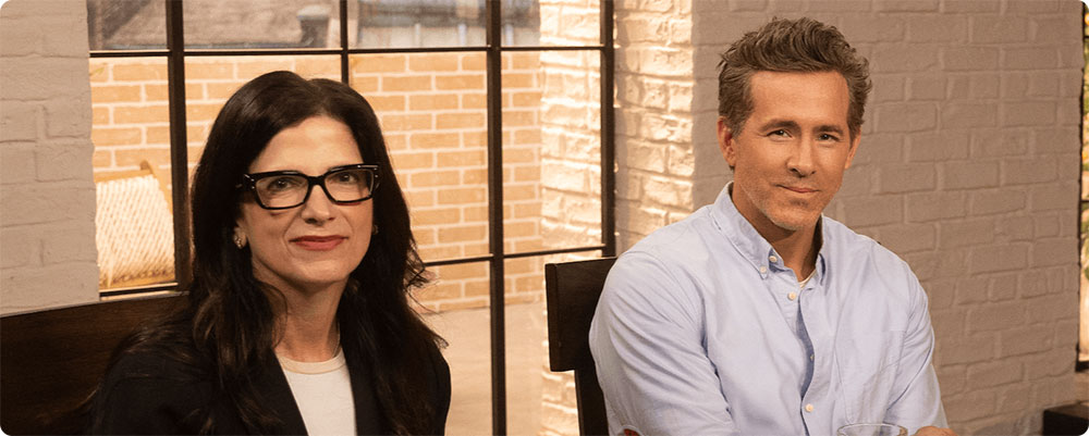 Ryan Reynolds and Dr. Brillman smiling at camera during their discussion